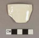 Molded cream-colored ironstone rim sherd