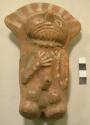 Pottery figurine of kneeling man