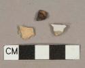 White tin-glazed eathenware vessel body fragment, buff paste, unidentified ferrous metal fragment