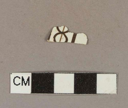 Brown hand painted whiteware body sherd