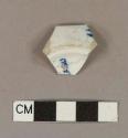 Blue hand painted whiteware base sherd, with illegible painted maker's mark on base