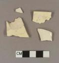 Undecorated creamware body sherds; two sherds crossmend