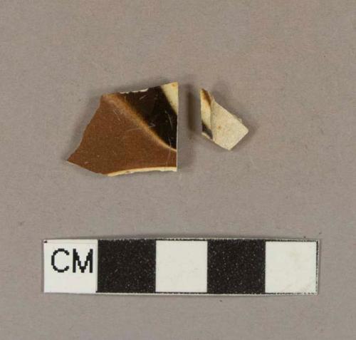 Factory-decorated slipware body sherds, likely marbelized decoration; two sherds crossmend