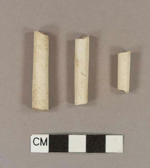 Unsmoked, undecorated pipe stem fragments; 6/64" bore diameter; three fragments crossmend