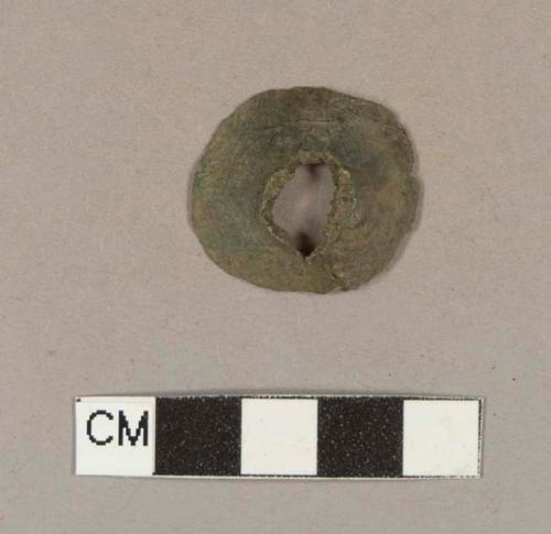 Unidentified semi-round, flat copper alloy object with a hole through the middle