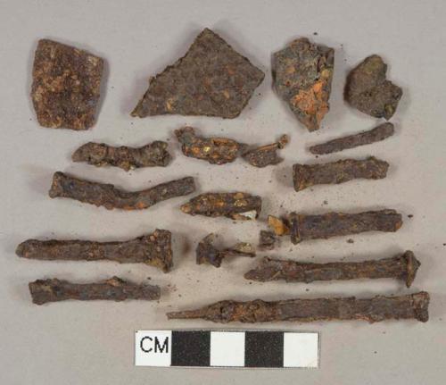 Ferrous metal nail fragments, heavily corroded, 11 unidentified flat ferrous metal fragments