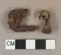 Ferrous metal hook and unidentified fragment, heavily corroded