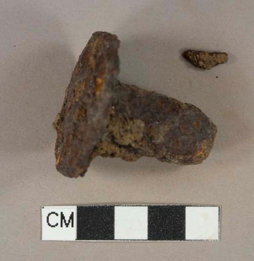 Ferrous metal bolt fragments, heavily corroded