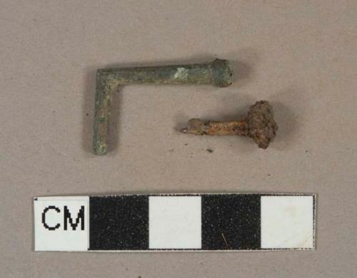 Copper alloy unidentified hardware fragment, ferrous metal nail fragment, corroded