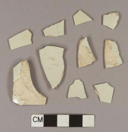 Undecorated pearlware body sherds; two sherds crossmend