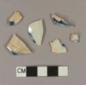 Blue hand painted pearlware body sherds; two sherds crossmend