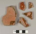 Undecorated lead glazed redware body sherds; two sherds crossmend