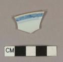 Blue hand painted porcelain rim sherd with brown glazed rim