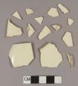 Undecorated creamware body sherds; two sherds crossmend