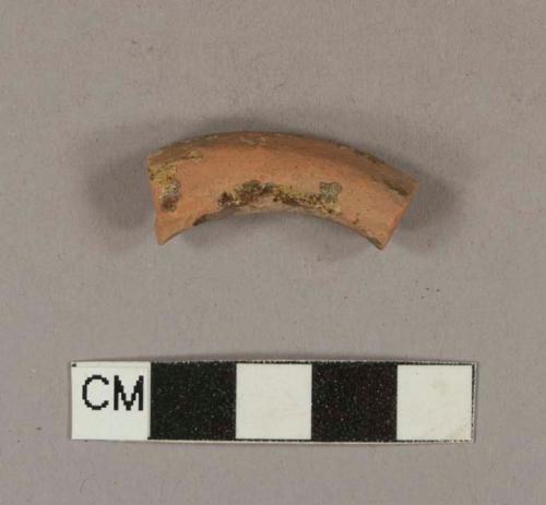 Slip decorated lead glazed redware handle sherd