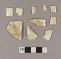 Undecorated creamware rim sherds; two sherds crossmend; five sherds crossmend