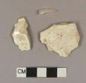 Undecorated creamware base sherds; two sherds crossmend