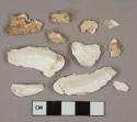 5 tooth fragments, 2 unidentified bone fragments, 15 unidentified shell fragments, 4 stone fragments, 1 unidentified lead fragment