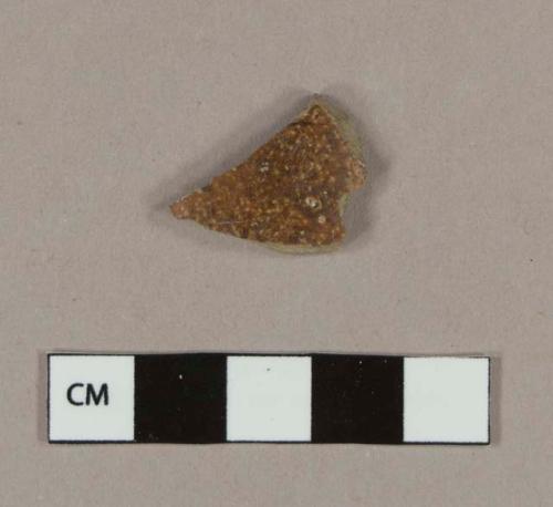 Brown slipped salt glaze stoneware body sherd with white slipped interior