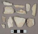 Shell fragments, 1 tooth fragment, 1 stone fragment, 1 undecorated white lead glazed earthenware fragment