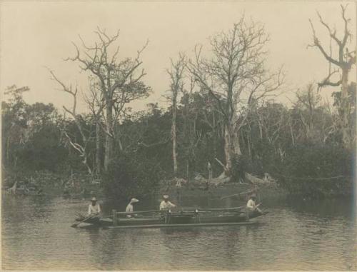 People in outrigger canoe