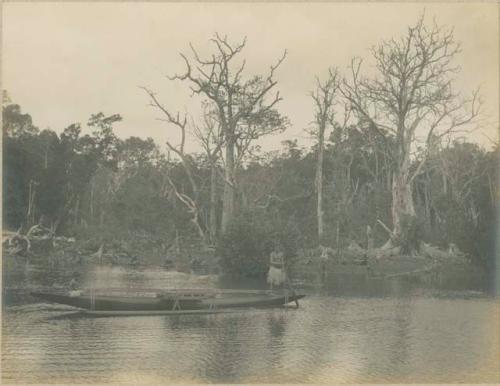 Man in outrigger canoe