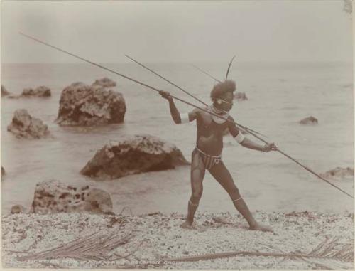 Man with spear on beach at Ahia