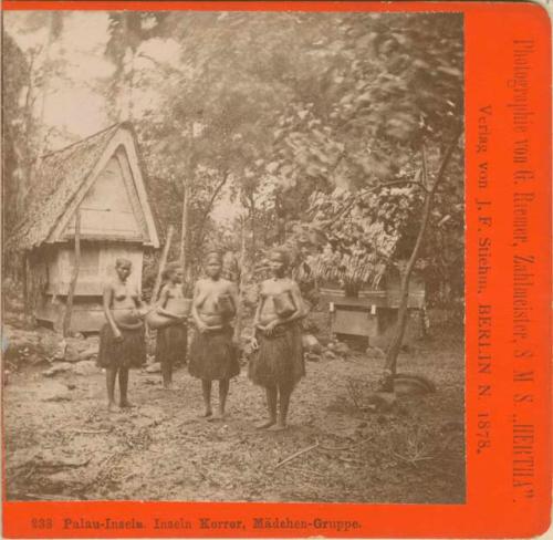 Four women standing in front of a house