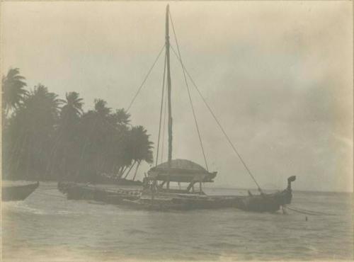 Boat, with shore in background