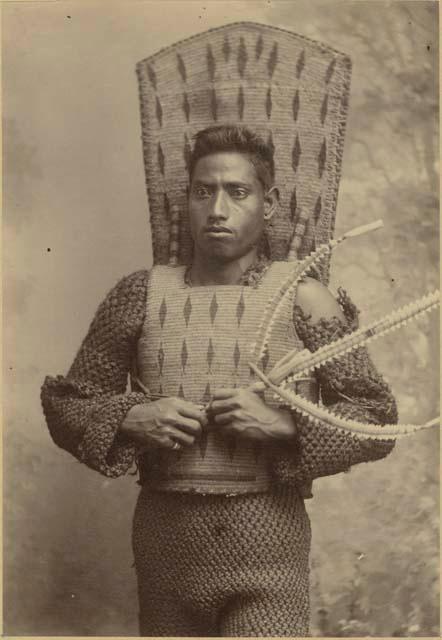 Man with taumangaria and coconut fiber armor