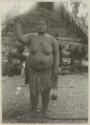 Woman standing in front of house