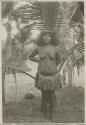 Woman standing in front of palm