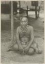 Man sitting on woven mat