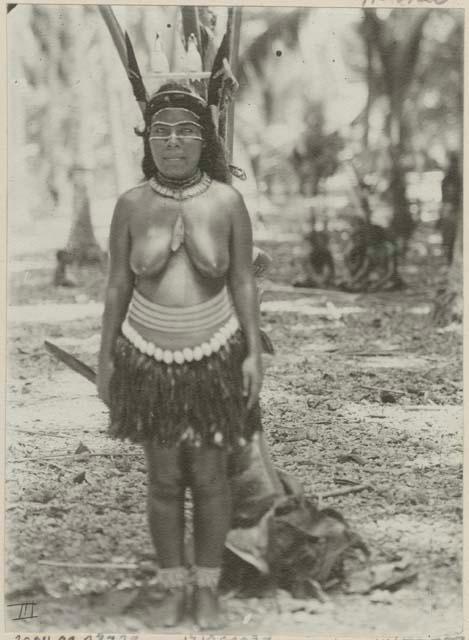 Woman standing in front of palm