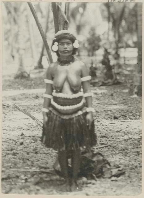 Woman standing in front of palm