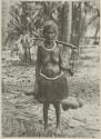 Woman standing in front of palm