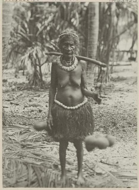 Woman standing in front of palm