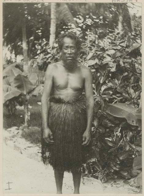 Man standing in front of trees