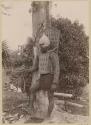 Man with taumangaria, coconut fiber armor and porcupine fish helmet