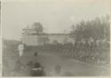 Large group sitting and standing around and on fort