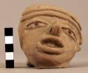 Large plain ware head (hallow) from figurine or effigy vessel