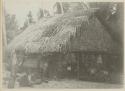 Group sitting in front of house