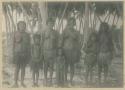 Group of women and children under palms