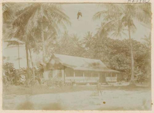 Person standing in front of house