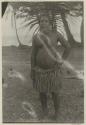 Man standing in front of palm