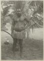 Man standing in front of palm