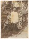 Man standing in front of plant