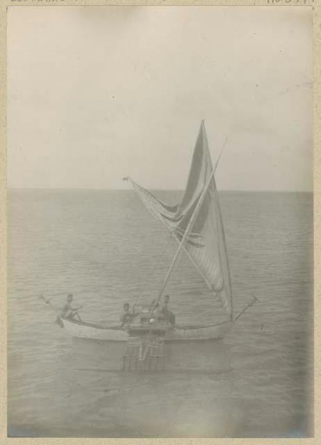 People in outrigger canoe