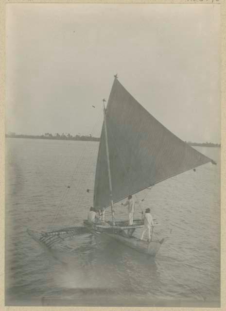 People in outrigger canoe