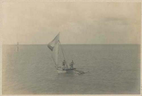 People in outrigger canoe